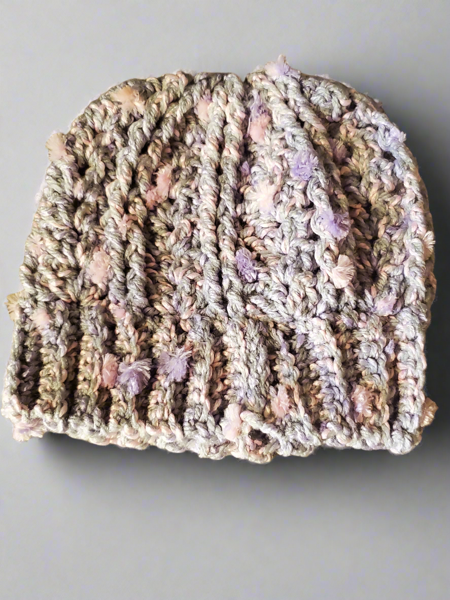 Beautiful soft crocheted baby hat in gray with multicolor speckles.