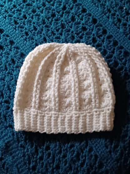 Handmade white crocheted beanie hat for men or women, simple style.
