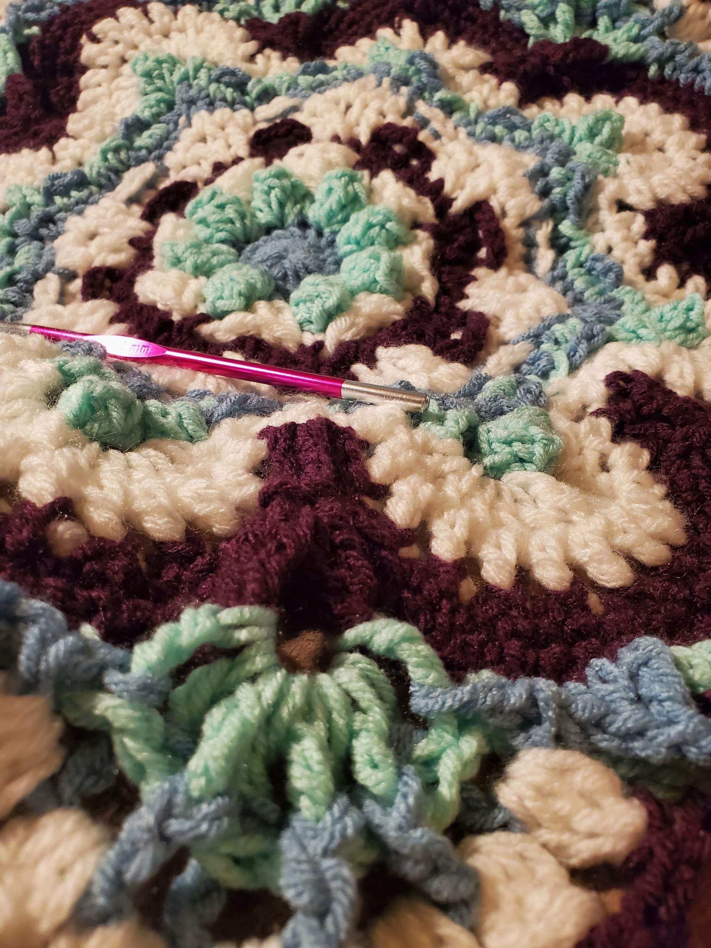 intricate crochet mandala stitch detail, mint purple white yarn texture