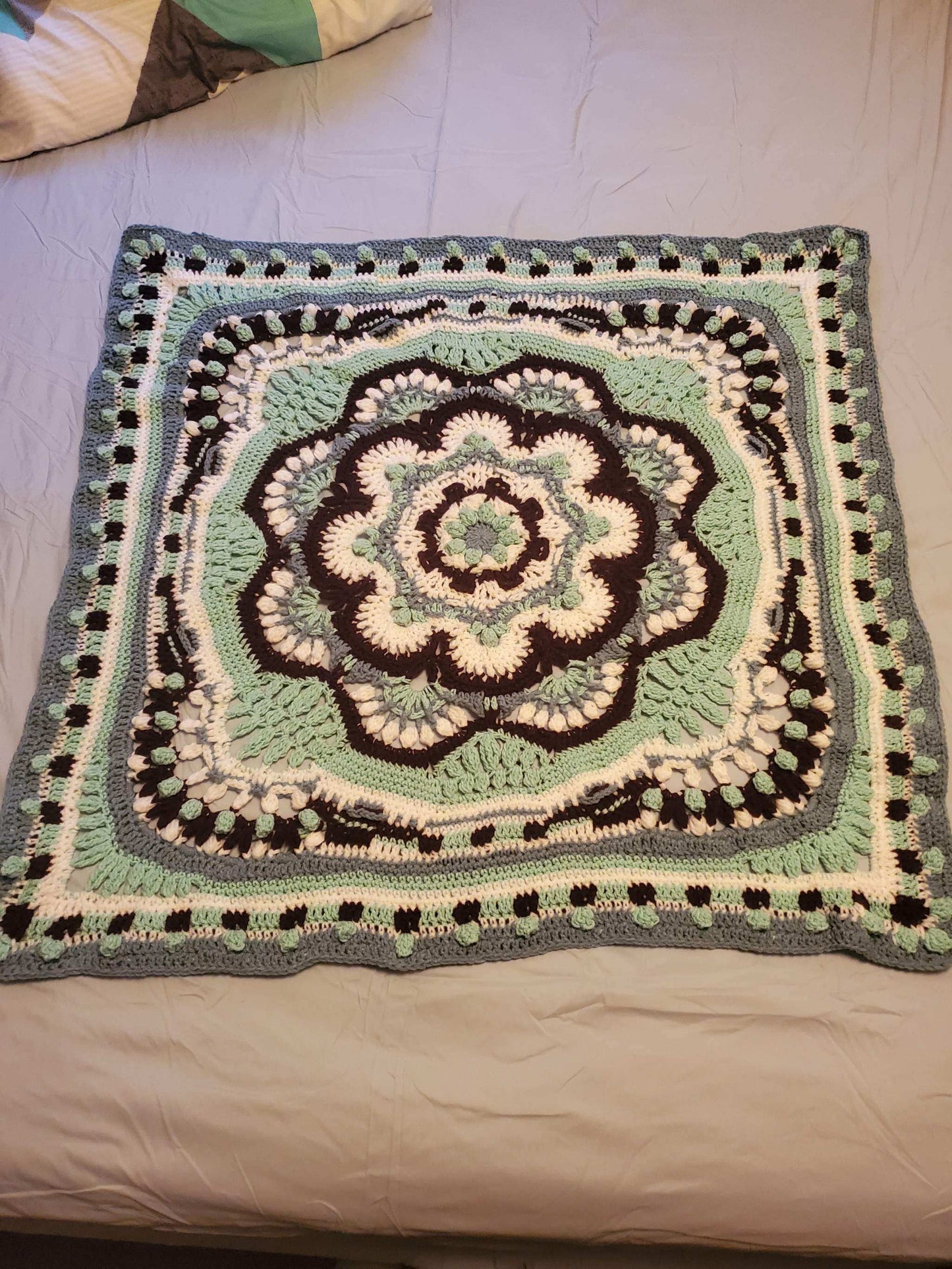 Crocheted Heritage Mandala Baby Girl Blanket, 42-inch square, intricate artistic design.