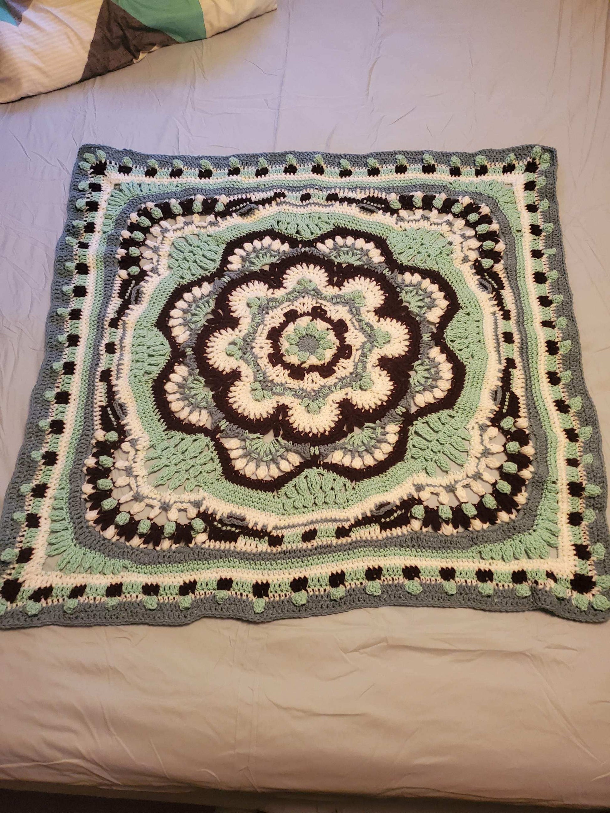 Crocheted Heritage Mandala Baby Girl Blanket, 42-inch square, intricate artistic design.