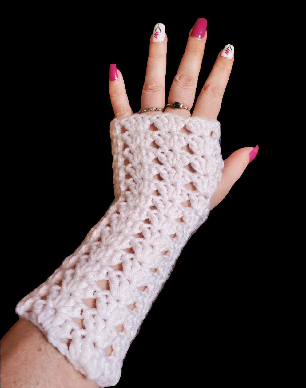 white crochet fingerless gloves with lacy open stitch design worn on hand