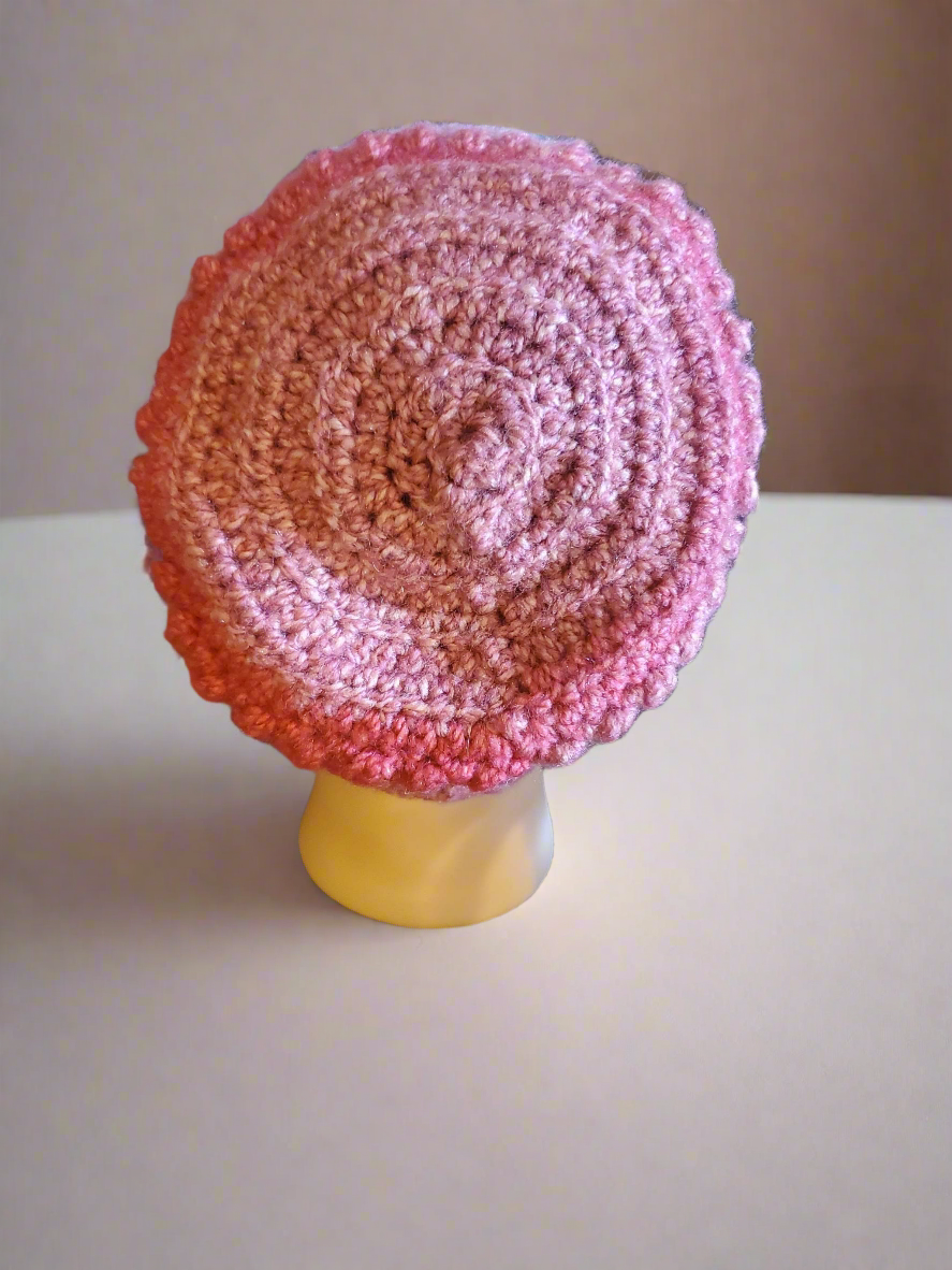 Beautifully crocheted soft pink hat for women and teens, perfect holiday accessory.