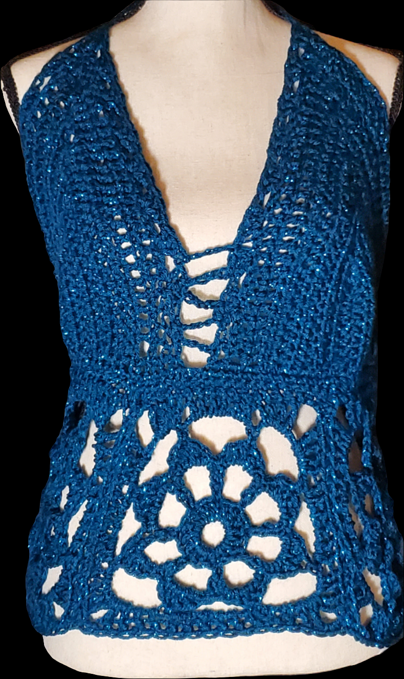 Whimsical crochet halter top with floral lace waistband.