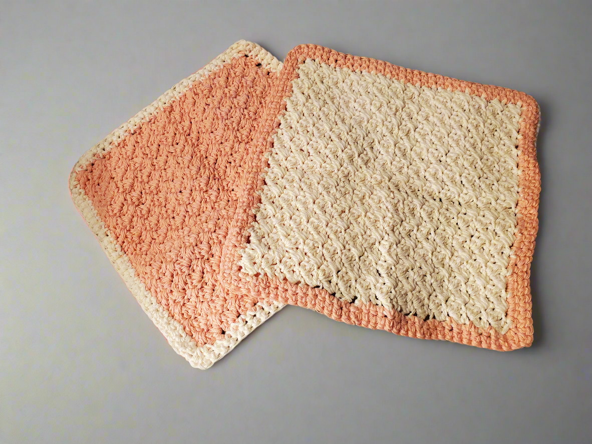 Tangerine Colored Dishcloths- Set of 4, showcasing intricate stitching and texture for kitchen cleaning.
