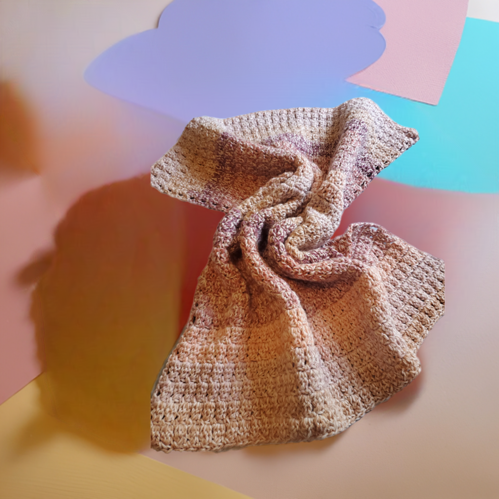 Chunky crochet baby blanket in blush tones, soft handmade nursery blanket