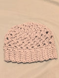 Silver gray crochet baby hat with textured stitch pattern and ribbed brim, handmade newborn beanie laid flat on a neutral background