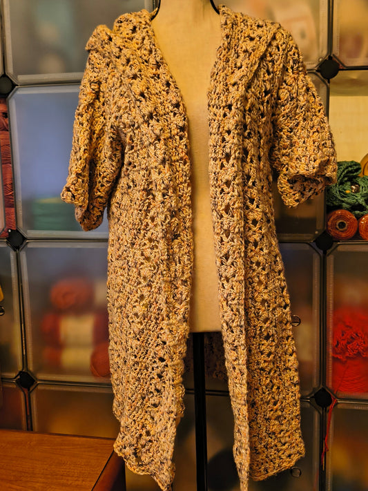 Handmade crochet hooded cardigan in soft neutral speckled cotton yarn, featuring an open front design, textured stitch pattern, and relaxed XL fit