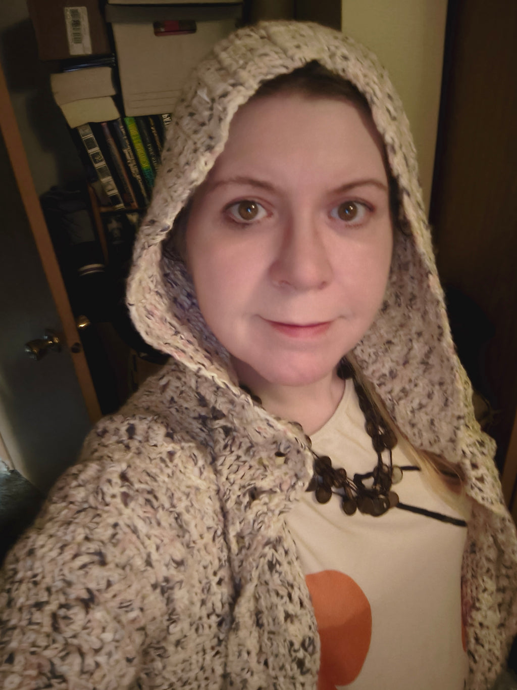 Handmade crochet hooded cardigan in soft neutral speckled cotton yarn, featuring an open front design, textured stitch pattern, and relaxed XL fit