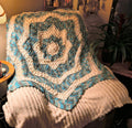 Handmade crochet star blanket in blue, gray, white, and camo tones featuring a mandala-inspired design and pointed edges, approximately 55 inches tip to tip